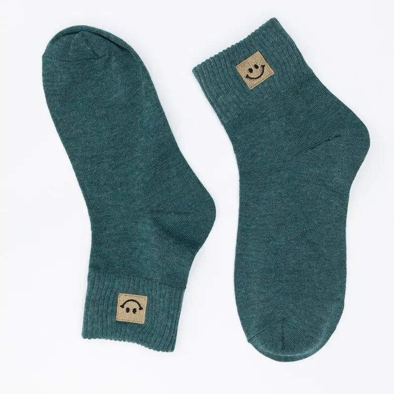 SNOWED IN smiley-face socks