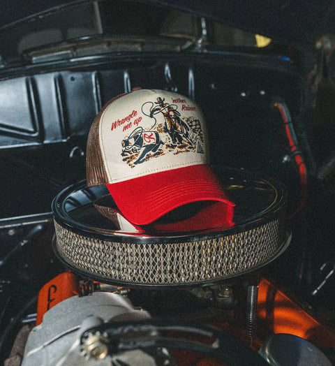WRANGLE trucker hat